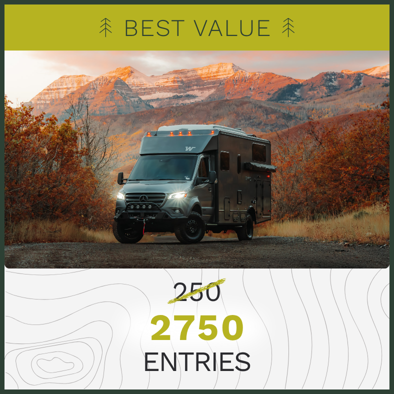 QUICK ENTRY - $250 - Camper Van parked on a dirt road with snow dusted mountains in the background and surrounded by orange autumn foliage.