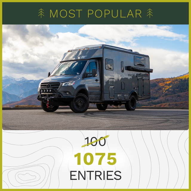 QUICK ENTRY -  $100 - Camper van parked at view lookout spot with snowy mountains in the background and fall foliage off in the distance.